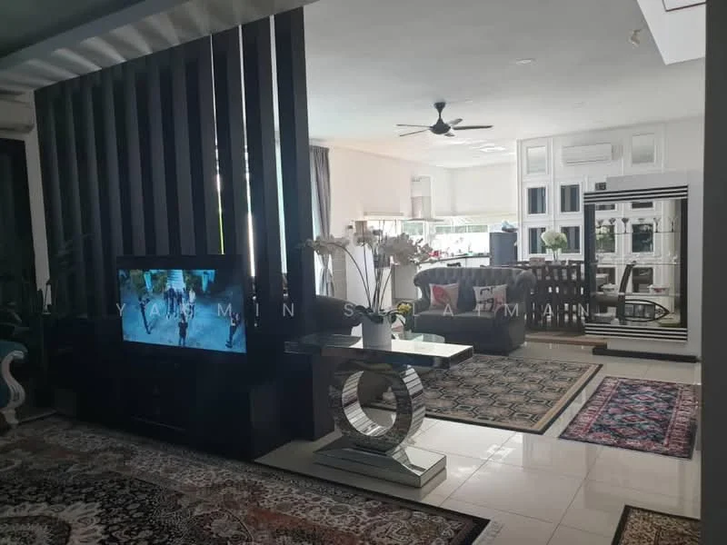 Living features: sofa in grey fabric, coffee table with mirrored base, TV console with TV, area rug with geometric pattern, ceiling fan, wall-mounted decorative panel, large windows with natural light, decorative plants, artwork on walls; style: modern. Kitchen features: white cabinetry, stainless-steel appliances, kitchen island, marble countertop, backsplash with tile, open layout to living area; style: modern.