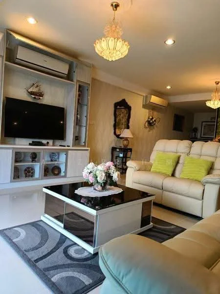 Living features: cream leather sofa, 3-seater sofa, glass coffee table with mirrored base, area rug with geometric pattern, wall-mounted TV, built-in shelving unit, decorative ship model on shelf, two ceiling chandeliers, wall-mounted air conditioning unit, framed artwork on wall, table lamp on side table; style: contemporary.