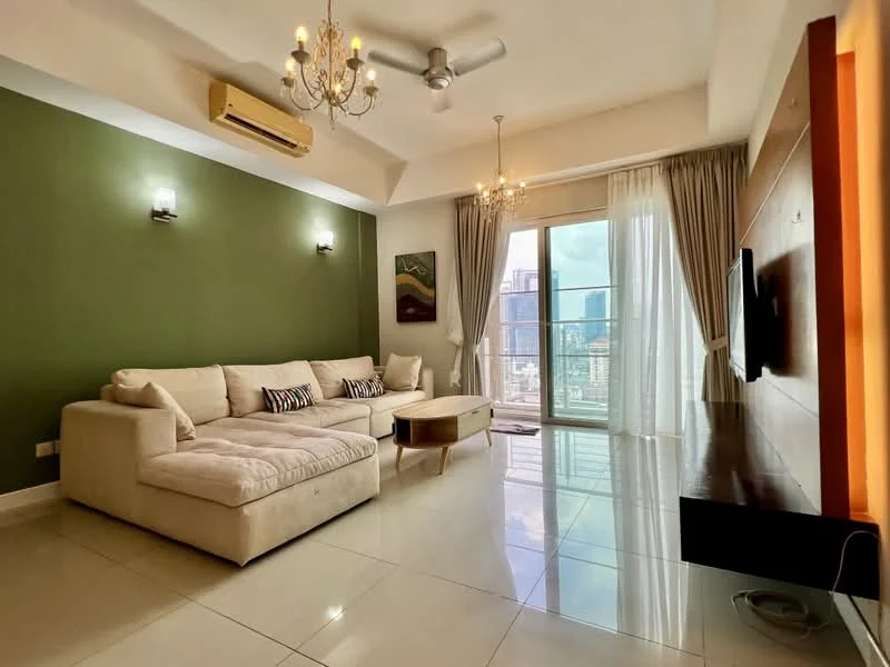 Living features: cream fabric sectional sofa, coffee table, wall-mounted TV, floating TV console, floor-to-ceiling windows, sheer curtains, recessed downlights, 5-blade ceiling fan with light, green accent wall, white painted walls, glossy tile flooring, decorative artwork; style: modern; view: city.