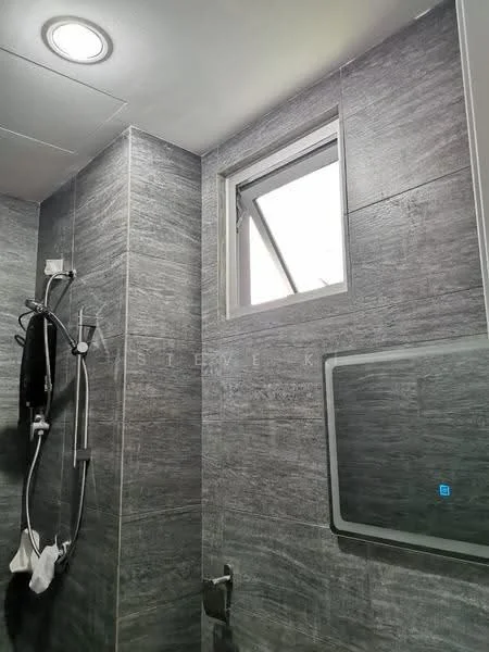 Bathroom features: grey tile cladding on walls, shower with glass enclosure, chrome showerhead, handheld shower, wall-mounted faucet, small window for ventilation, built-in mirror, toilet, towel rack; style: modern.