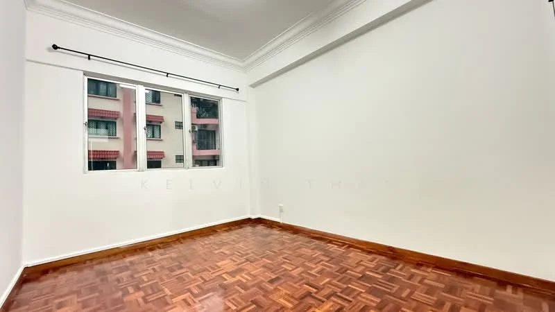 Room features: white painted walls, parquet wood flooring, crown moulding, large window with view of neighboring building, natural light, no visible furniture, neutral color scheme; style: modern; view: city.