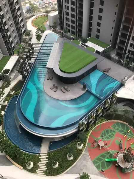 Exterior type: high-rise condominium; features: infinity pool, pool deck with loungers, landscaped garden area, children's playground, manicured lawn, green rooftop, modern architectural design, surrounded by greenery; style: modern.