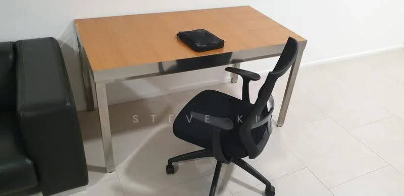 Room features: wooden table with stainless steel legs, black office chair with wheels, light-colored tiled flooring, white painted walls; style: modern.