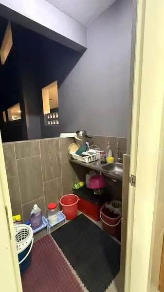 Laundry features: single-bowl stainless-steel sink, wall-mounted shelves, grey tiled walls, dark flooring, plastic storage bins in red and pink, laundry basket, dish rack, cleaning supplies, rubber mat, countertop for folding clothes; style: modern.