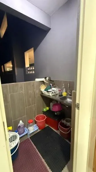 Laundry features: grey painted walls, ceramic tile flooring, single-bowl stainless-steel sink, wall-mounted faucet, built-in shelving, laundry basket, cleaning supplies, plastic storage bins, rubber mat, drainage area.