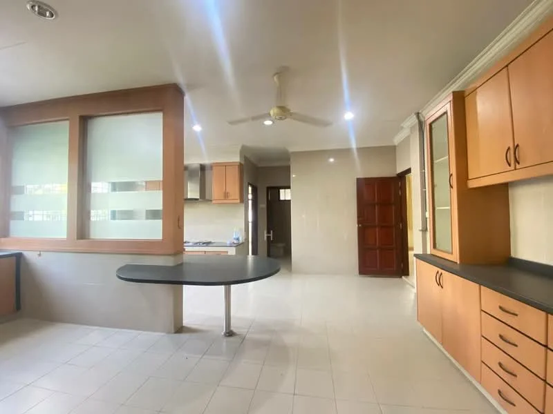 Kitchen features: light-colored tiled flooring, cream painted walls, wood cabinetry with orange finish, black countertop, kitchen island with circular table, stainless-steel sink, ceiling fan, recessed lighting, large windows with frosted glass, open layout to adjacent room, built-in cabinets, doorway leading to hallway; style: modern.