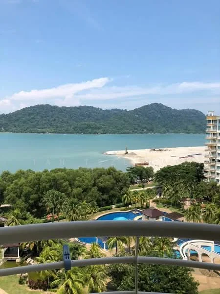 Exterior type: high-rise condominium; features: view of the sea, surrounded by greenery, infinity pool visible, landscaped garden, beach area in the distance, mountain backdrop, balconies on the building, swimming pool deck, palm trees, manicured lawn; style: modern.