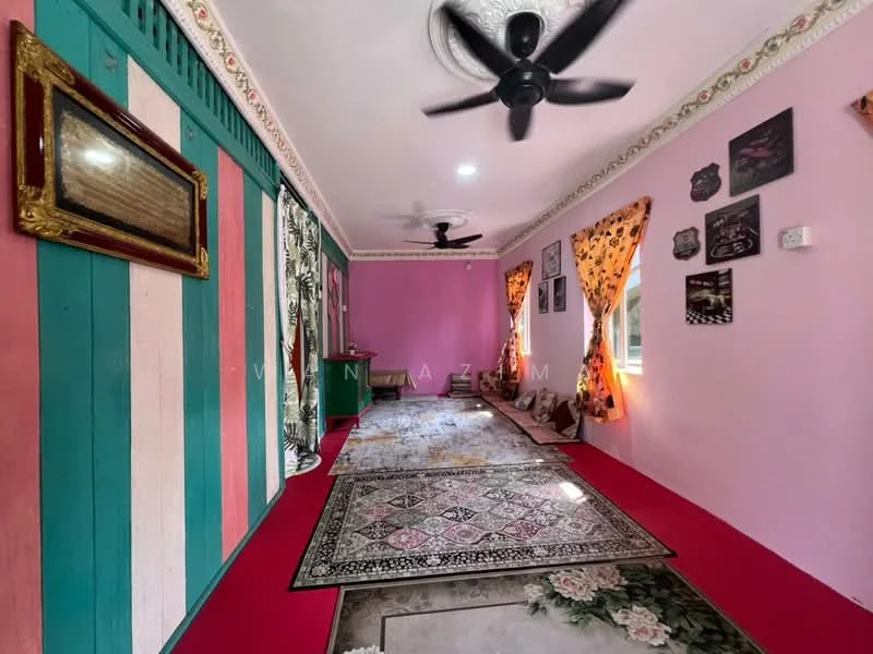 Room features: pink painted walls, striped wall with green and pink sections, ceiling fan, recessed ceiling lights, decorative wall art, framed artwork, curtains with floral pattern, area rug with intricate design, wooden flooring, decorative molding at ceiling; style: traditional.
