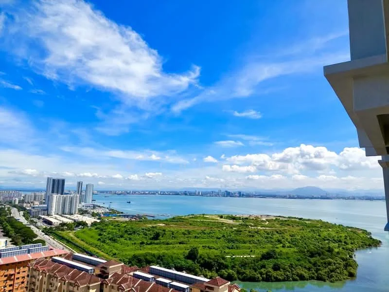 Exterior type: high-rise condominium; features: panoramic sea view, city skyline in background, lush greenery in foreground, clear blue sky, waterfront landscape; style: modern.