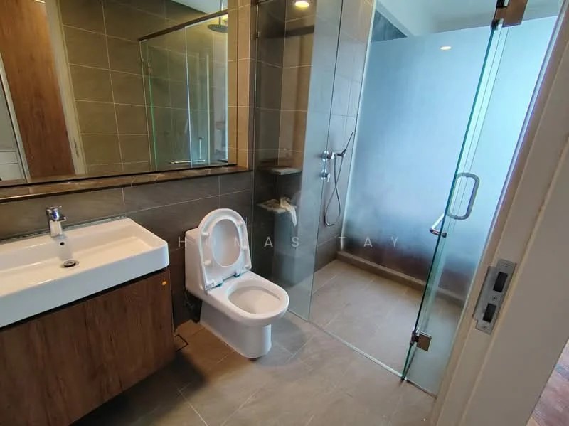 Bathroom features: single-sink vanity with wood cabinet, white countertop, mirror above vanity, one-piece toilet, walk-in shower with glass enclosure, rain shower head, handheld shower, grey tile flooring, grey wall tiles, chrome faucet, glass shower door, recessed lighting; style: modern.