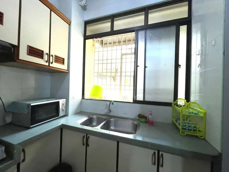 Kitchen features: double-bowl stainless-steel sink, chrome pull-down faucet, light blue laminate countertop, white cabinetry with wooden handles, microwave, window with metal grille, tile backsplash, grey tiled flooring.