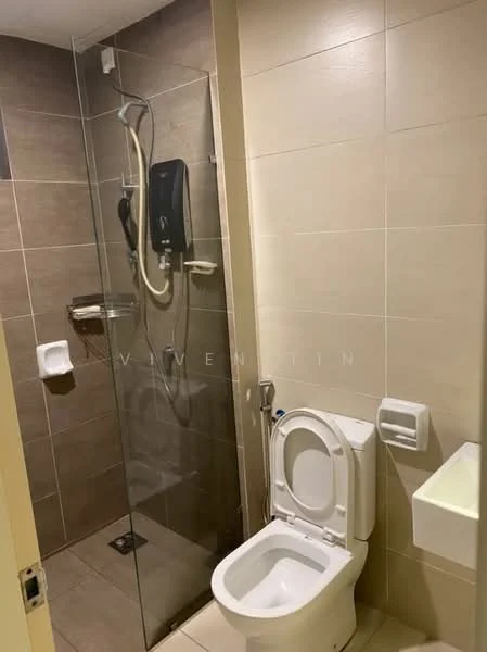 Bathroom features: glass shower enclosure, rain shower head, wall-mounted shower control, toilet, wall-mounted sink, tile flooring, beige wall tiles, chrome towel rail, soap dispenser, built-in shelf; style: modern.