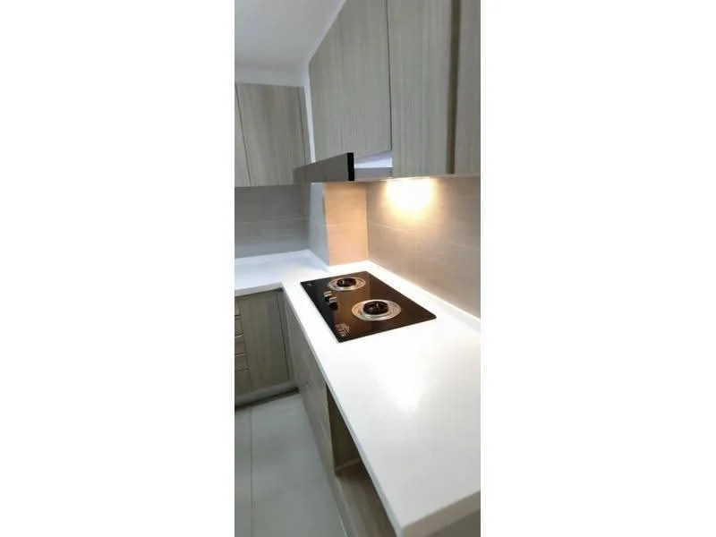 Kitchen features: light wood cabinetry, white countertop, built-in stove with two burners, grey tiled backsplash, under-cabinet lighting, ceramic tile flooring, single-bowl stainless-steel sink, modern faucet; style: modern.