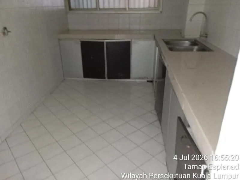 Kitchen features: white tiled walls, white tiled flooring, L-shaped countertop, stainless-steel sink, chrome faucet, built-in cabinets with sliding doors, window with horizontal blinds, space for refrigerator.