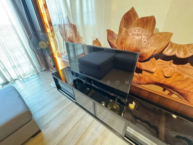 Living features: 3-seater fabric sofa in grey, black TV console, wall-mounted TV, decorative wall with lotus design, floor-to-ceiling windows, sheer curtains, wooden flooring, ceiling fan; style: modern; view: city.
