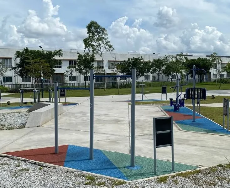 Exterior type: landscape garden; features: outdoor gym equipment, playground area, rubberized flooring, concrete pathways, manicured grass, surrounding trees, open space, park benches; style: modern.