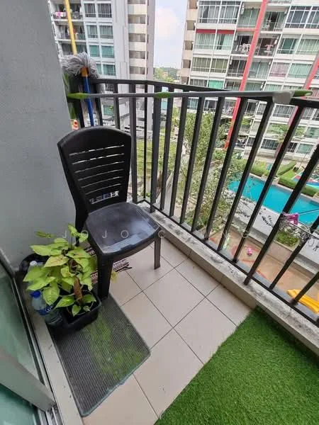 Balcony features: black plastic chair, small potted plant, green artificial grass mat, tiled flooring, metal railing, view of swimming pool, view of landscaped garden, high-rise building backdrop; view: pool.