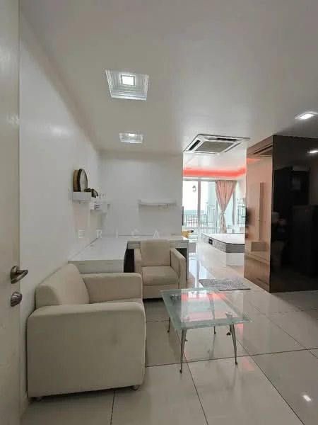 Living features: white painted walls, glossy tile flooring, recessed downlights, ceiling-mounted air conditioning unit, 2-seater fabric sofa in white, glass coffee table, open shelving unit, large window with sheer curtains; style: modern.