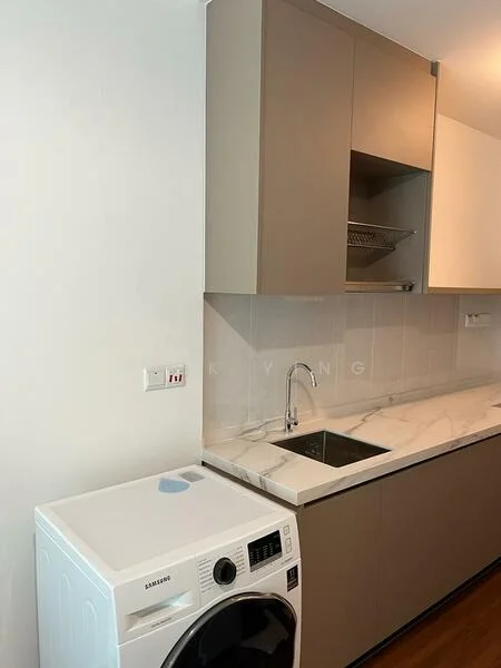 Laundry features: white front-load washing machine, single-bowl stainless-steel sink, marble countertop, grey cabinetry, wall-mounted storage rack, light wood flooring, white painted walls; style: modern.