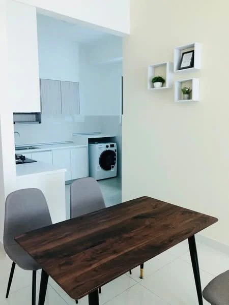 Dining features: wooden dining table, 4 dining chairs in grey, light-colored walls, white shelving unit on wall with plants, tile flooring, natural light from kitchen area; style: modern. Kitchen features: white cabinetry, stainless-steel gas hob, built-in oven, white countertops, washing machine visible, light-colored backsplash, open layout to dining area; style: modern.