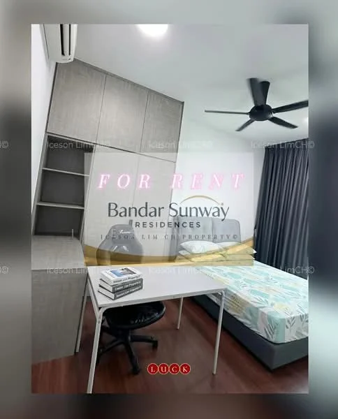 Bedroom features: single bed with yellow bedding, study desk with white surface, black office chair, built-in wardrobe with grey doors, grey curtains, ceiling fan, air conditioning unit, decorative wall art, light-colored flooring; style: modern.