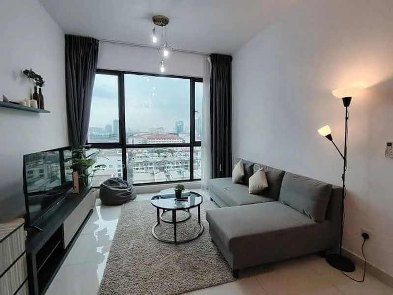 Living features: grey fabric sectional sofa, round glass coffee table, area rug with neutral color, floor-to-ceiling windows, city skyline view, wall-mounted TV, black TV console, decorative plants, curtains in dark grey, ceiling light fixture with exposed bulbs, standing floor lamp; style: modern; view: city.