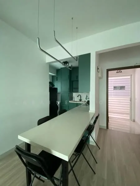 Kitchen features: white walls, light wood flooring, long white countertop, black chairs, green cabinetry, stainless-steel sink, chrome pull-down faucet, built-in refrigerator, recessed lighting, open layout, kitchen island; style: modern. Room features: white walls, light wood flooring, doorway leading to hallway.