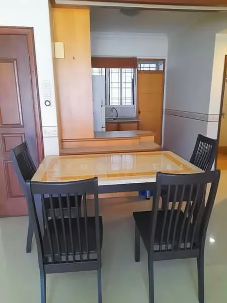 Dining features: 4-seater dining table with marble top, black wooden dining chairs, glossy tile flooring, wooden cabinetry, open layout to kitchen, natural light from window, neutral wall color, decorative wall paneling; style: modern. Kitchen features: kitchen countertop, white cabinetry, appliances visible in background; style: modern.