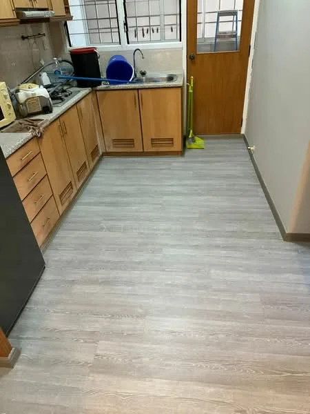 Kitchen features: laminate flooring, grey wood-look flooring, wood cabinetry, granite countertop, stainless-steel sink, chrome pull-down faucet, built-in gas stove, microwave, kitchen door, window with grid pattern, cleaning supplies, countertop appliances; style: modern.