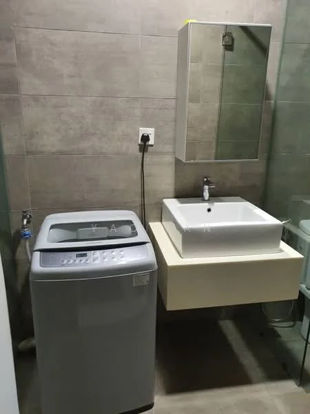 Bathroom features: grey tiled walls, light grey tiled flooring, floating vanity with beige cabinet, white square sink, chrome faucet, mirror above sink, washing machine, glass shower enclosure, toilet, wall-mounted storage cabinet; style: modern.