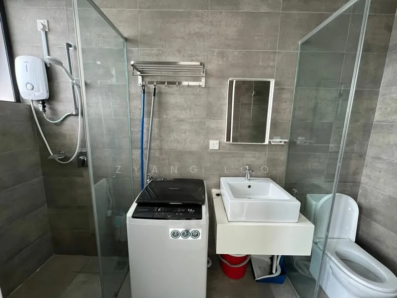 Bathroom features: grey tiled walls, grey tiled flooring, walk-in shower with glass enclosure, chrome shower head, single-sink vanity with white cabinet, square ceramic sink, framed mirror, one-piece toilet, washing machine, wall-mounted water heater, towel rack; style: modern.