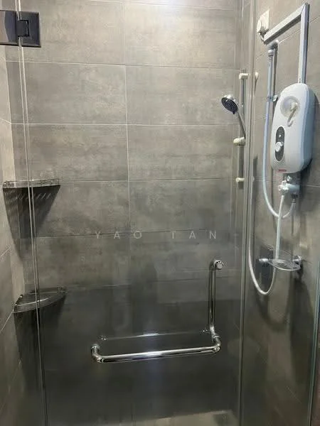 Bathroom features: walk-in shower with glass enclosure, chrome handheld shower head, wall-mounted shower control, grey tile walls, grey tile flooring, built-in corner shelves, grab bar, water heater, chrome shower rail; style: modern.