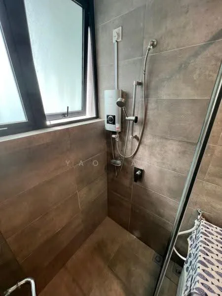 Bathroom features: walk-in shower with glass enclosure, rain shower head, handheld shower, chrome basin mixer, grey tile cladding on walls, dark tile flooring, built-in shower niche, window for natural light, shower control panel, towel rack; style: modern.