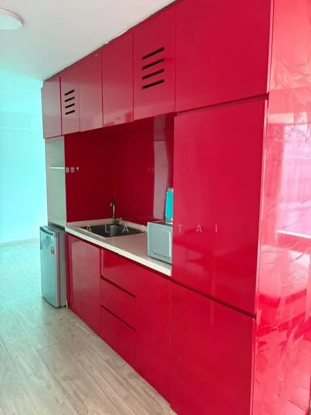 Kitchen features: red glossy cabinetry, white countertop, stainless-steel fridge, built-in microwave, single-bowl stainless-steel sink, chrome pull-down faucet, wooden flooring, ventilation grilles, under-cabinet lighting; style: modern.