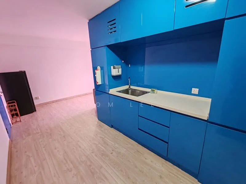 Kitchen features: blue cabinetry, single-bowl stainless-steel sink, chrome pull-down faucet, white countertop, built-in microwave, refrigerator, wood laminate flooring, wall-mounted paper towel holder, under-cabinet lighting; style: modern.