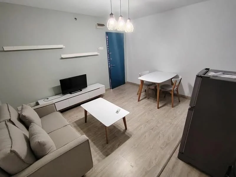 Living features: light grey painted walls, laminate flooring, 3-seater fabric sofa in light grey, white coffee table, TV console with storage, wall-mounted TV, dining table for 4 with white tabletop, 4 wooden dining chairs, refrigerator, suspended light fixture with multiple bulbs, blue front door; style: modern.