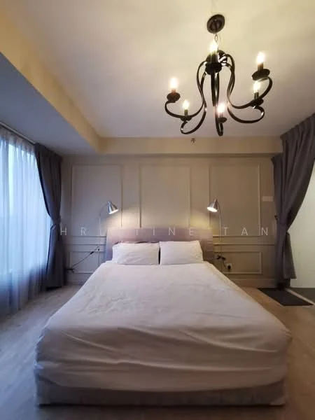 Bedroom features: queen-size bed with white bedding, chandelier with multiple bulbs, grey curtains, wooden flooring, wall paneling, two wall-mounted reading lamps, large window with sheer curtains, decorative wall molding; style: modern.