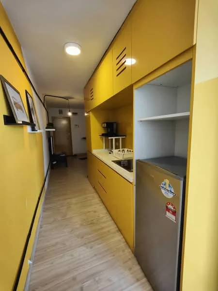Kitchen features: yellow painted walls, laminate flooring, white countertop, single-bowl stainless-steel sink, chrome pull-down faucet, built-in oven, stainless-steel fridge, open shelving, under-cabinet lighting, kitchen cabinetry with flat-panel design, wall-mounted light fixture; style: modern.