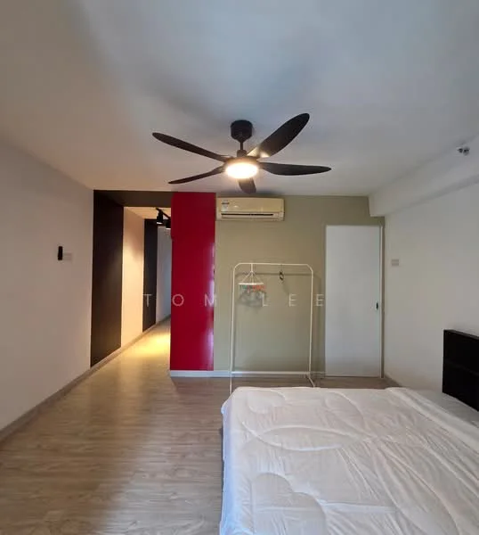Room features: light wood flooring, white walls, black accent wall, red accent wall, 5-blade ceiling fan with light, wall-mounted air conditioning unit, clothes rack, unmade bed with mattress, built-in wardrobe, recessed lighting; style: modern.