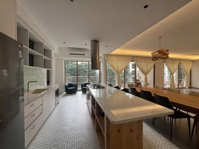 Kitchen features: white cabinetry, stainless-steel fridge, built-in oven, 4-burner gas hob, white quartz countertop, hexagonal tile flooring, pendant light fixture, double-bowl stainless-steel sink, chrome pull-down faucet, open shelving, window with sheer curtains, island with seating, recessed downlights; style: modern; view: garden. Dining features: wooden dining table, black dining chairs, large windows, natural light, decorative centerpiece; style: modern; view: garden.