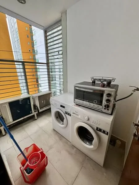 Laundry features: two front-load washing machines, microwave oven, tile flooring, window with horizontal slats, cleaning supplies, broom, red plastic basket, air conditioning unit.