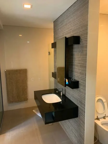Bathroom features: black wall-mounted vanity with integrated sink, framed mirror, chrome basin mixer faucet, toilet, tiled walls with grey accent, light-colored floor tiles, towel rack, shower area with glass enclosure; style: modern.