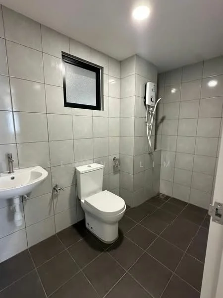 Bathroom features: white ceramic toilet, wall-mounted basin with chrome faucet, grey tiled walls, dark grey tiled flooring, shower area with wall-mounted showerhead, window with frosted glass, electric water heater, recessed ceiling lights; style: modern.