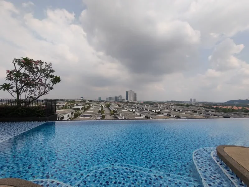 Exterior type: swimming pool deck; features: infinity pool, blue mosaic tile pool surface, surrounding deck area, landscaped area with flowering plants, view of city skyline, cloudy sky; style: modern.