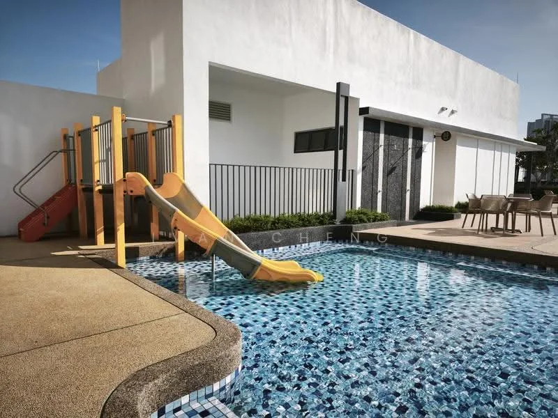 Exterior type: swimming pool deck; features: swimming pool with mosaic tile, yellow water slide, playground structure with slide, outdoor dining area with table and chairs, manicured landscaping, concrete pool deck, guard rail, modern building facade; style: modern.
