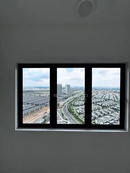 Room features: floor-to-ceiling windows, black window frames, city skyline view, high-rise buildings in the distance, road visible below, cloudy sky; view: city.