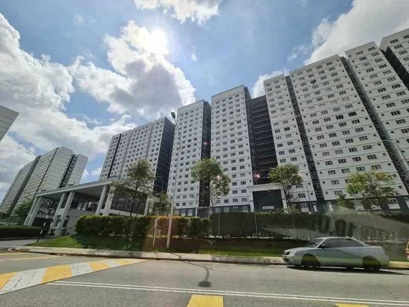 Exterior type: high-rise condominium; features: white painted facade, black accent panels, glass curtain wall, approximately 10-storey high-rise, manicured lawn, mature trees, covered entrance, surrounded by greenery, parking area visible, street view, urban context; style: modern.