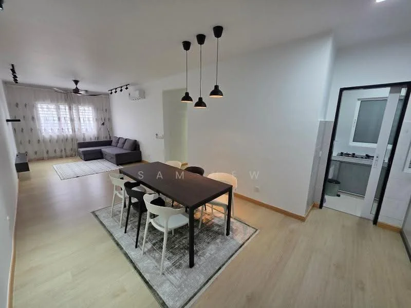 Dining features: rectangular dining table with black legs, white dining chairs, pendant lighting above the table, area rug under the dining table, wooden flooring, neutral wall colour, air conditioning unit on wall; style: modern. Living features: grey fabric sofa, white walls, large window with sheer curtains, light-coloured area rug, ceiling fan, TV console, decorative wall art; style: modern. Kitchen features: kitchen counter with built-in stove, white cabinetry, grey backsplash, sink, refrigerator, open layout to dining area; style: modern.