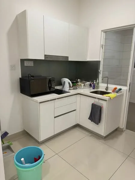 Kitchen features: white cabinetry, grey backsplash, single-bowl stainless-steel sink, chrome pull-down faucet, built-in microwave, electric kettle, countertop with utensils, tile flooring, cleaning bucket, dish towels; style: modern.