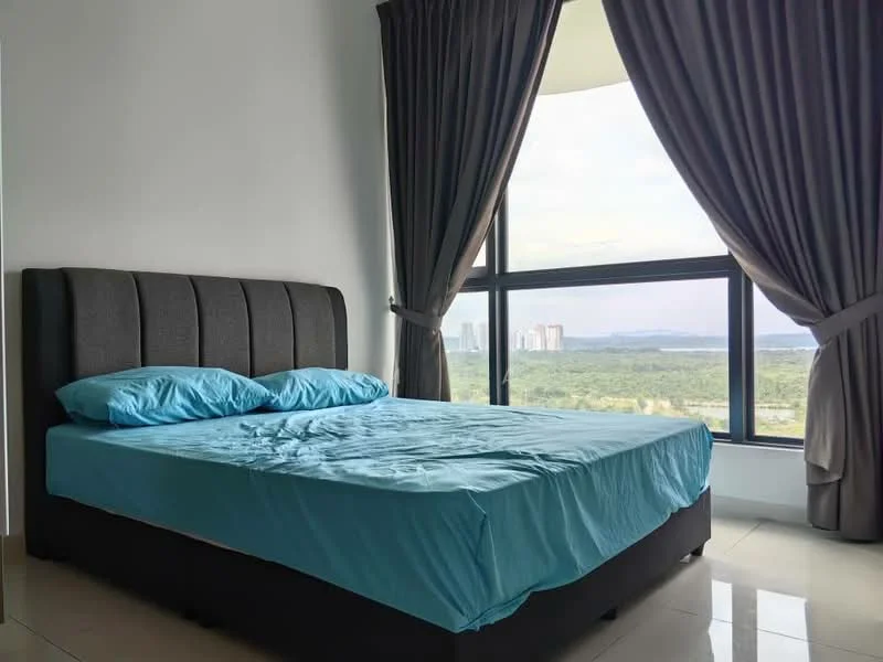 Bedroom features: king-size bed with upholstered headboard, blue bedding, floor-to-ceiling windows, curtains in grey, tile flooring, view of city skyline, nightstand, decorative wall, natural light; style: modern; view: city.